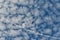 Texture of the blue sky with thin white clouds crossed out by a