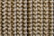 Texture of brown-beige jute carpet surface close-up