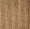 Texture of brown burlap, rough fabric with fibers for bags, macro