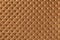 Texture of brown and copper leather background with capitone pattern, macro