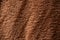 Texture of a brown faux fur as a background