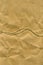 Texture of brown paper divided in half by packing twine as an abstract background
