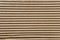 Texture of brown ribbed cardboard, striped carton