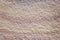 Texture brown sandstone in rainbow patterns on background