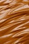 Texture of brown whipped chocolate, caramel or coffee cream