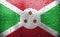 Texture of Burundi flag on the glass with drops