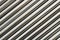 Texture of chrome steel pipe sort in diagonal, abstract background