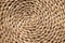 Texture with a circular pattern made with braided palm leaves