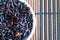 Texture of Coarse black rice in white plate The concept of proper nutrition and healthy lifestyle. Top view, close-up as backgroun