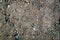 Texture of concrete floor background with small stones. Granular texture of concrete with gravel particles, small stones, black,