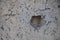 Texture of concrete with a round hole. Gray textured background