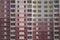 Texture concrete wall background, many windows, skyscraper tall house, stay at home pink wall with windows of a large