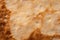 Texture of a cooked thin pancake closeup.