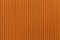 Texture corrugated orange paper. Striped background