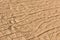 Texture of crackled red clay in desert