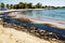 Texture of crude oil spill on sand beach from oil spill accident, Agios Kosmas bay, Athens, Greece, September 14 2017.