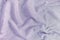 The texture of a crumpled terry towel. Blank light lilac background.