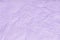 Texture of crumpled violet wrapping paper, closeup. Lilac old background