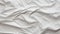 Texture of crumpled white paper, top view. Light gray crumpled paper background