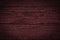 Texture of dark burgundy old rough wood. Mahogany abstract background for design.