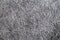 Texture of a dark gray soft carpet with a fleecy basis