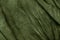 Texture of dark khaki crumpled fabric