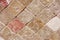 Texture of decorative brown ceramic tile with rhombus patterns, cracks and divorces