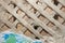 Texture of the destroyed wall of a living room. Shingles nailed to the wall cross to cross for fixing the plaster. Photography -