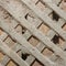 Texture of the destroyed wall of a living room. Shingles nailed to the wall cross to cross for fixing the plaster. Photography -