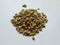 Texture of Dhaniya Seeds. Heap of a Coriander or Dhania Seeds isolated in a white Background