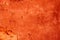 Texture of a dilapidated orange decorative plaster. Abstract background for design