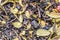 texture of dry herbal tea with berries and leaves of blueberries and cranberries, ingredient drink abstraction background