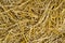 Texture of dry straw. Yellow dry hay background close-up.