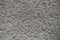 Texture of dusty grey grainy concrete wall