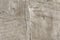 Texture of an embossed antique concrete wall with cracks and a ruined plaster protective layer