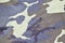 Texture of fabric with a camouflage painted in colors of the marsh. Army background image. Textile pattern of military camouflage