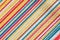 Texture of fabric with colorful diagonal stripes pattern.