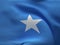 Texture of a fabric with the image of the flag of Somalia, waving in the wind.