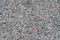 The texture of fine gray gravel. View from above