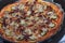 The texture of the finished pizza is the texture of the top layer with melted cheese and smoked sausage. The process of cooking a
