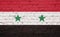 Texture of a flag of Syria on a pink brick