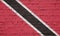 Texture of a flag of Trinidad and Tobago on a wall.