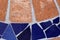 Texture of a Floor Made of Orange & Blue Tiles