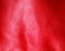 Texture of folds vivid red skin leather background