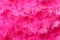 Texture of fuzzy pink fabric as background