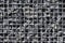 Texture of gabion fence, made of durable mesh and large stones. European gabion fence