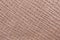 Texture of genuine grainy leather close-up, color of porous milk chocolate. Fashionable modern background, copy space