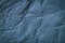 Texture of genuine leather close-up, surface close-up with wrinkles and cracks, blue color print, trendy background