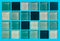 The texture of glass tiles with square elements of blue shades. Blue, white and turquoise squares on a light blue background