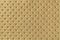 Texture of golden leather background with capitone pattern, macro